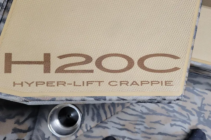 Slide: The Image of 2026 Xpress H20C Crappie boat interior with Hyper-Lift Crappie branding. - 6