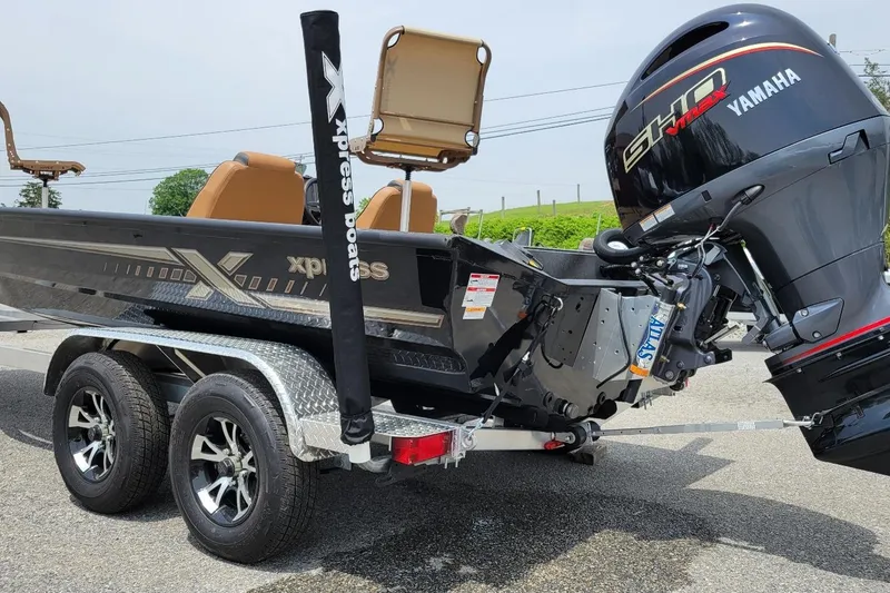 Slide: The Image of 2026 Xpress H20C Crappie boat with Yamaha engine on a trailer. - 2