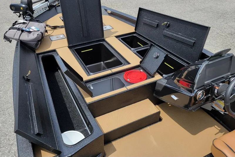 Slide: The Image of 2026 Xpress H20C Crappie boat interior with storage compartments and control panel. - 5