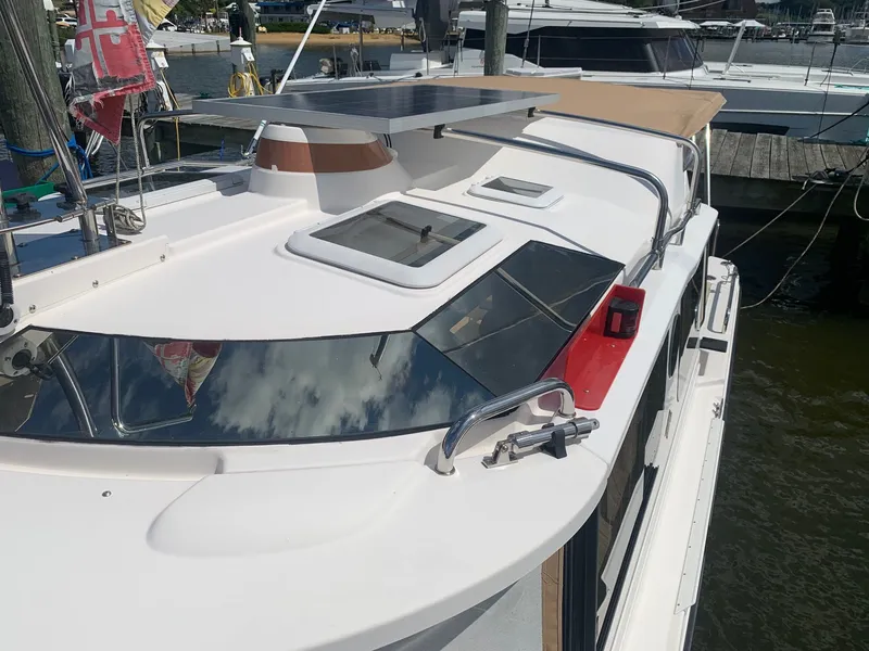 Slide: The Image of 2020 Ranger Tugs R-25 boat with solar panel and sleek design, docked at marina. - 14