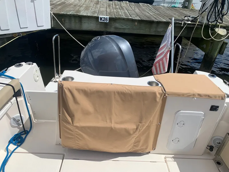 Slide: The Image of 2020 Ranger Tugs R-25 boat stern with motor, docked at pier K26. - 19