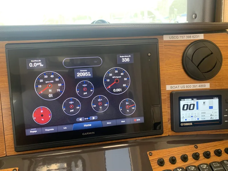 Slide: The Image of Dashboard of a 2020 Ranger Tugs R-25 with Garmin and Yamaha displays. - 26
