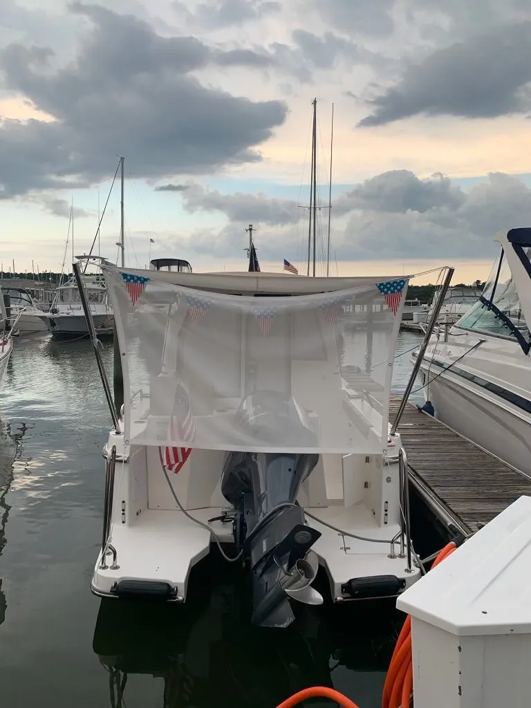 Slide: The Image of 2020 Ranger Tugs R-25 boat docked at marina under cloudy sky. - 42