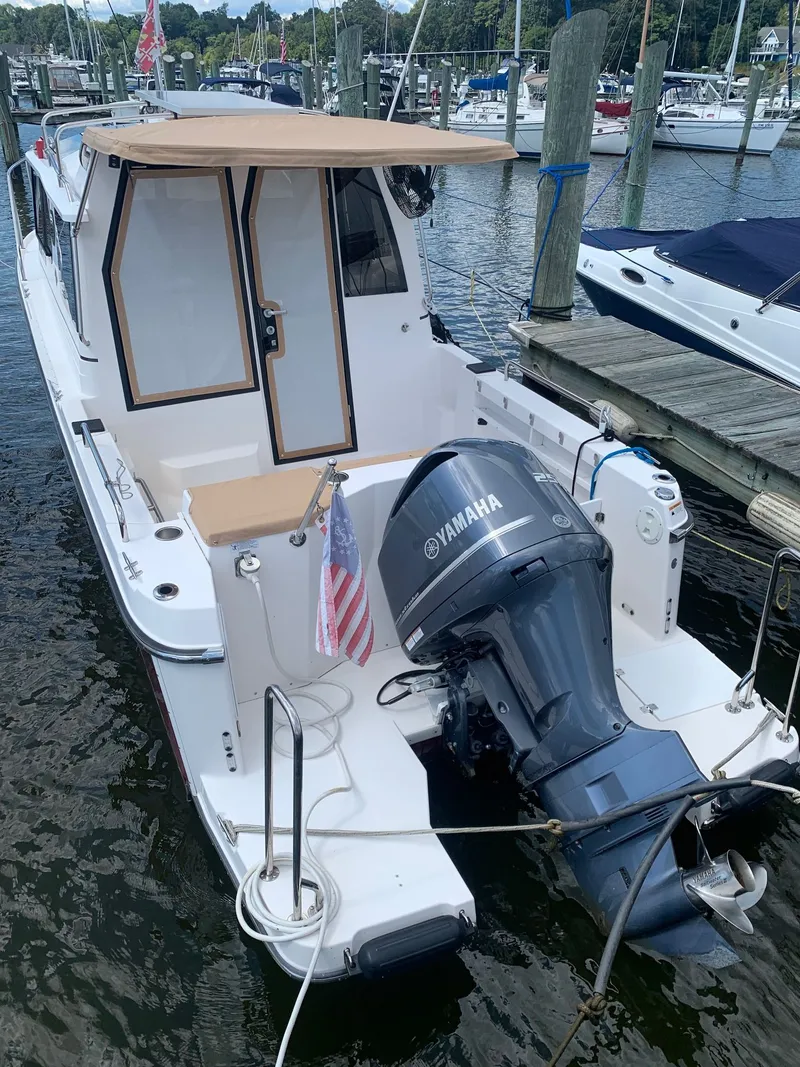 Slide: The Image of 2020 Ranger Tugs R-25 boat with Yamaha outboard motor docked at marina. - 5