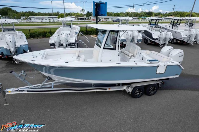 Slide: The Image of 2026 Sea Hunt Ultra 265 SE boat on trailer, displayed at dealership. - 13
