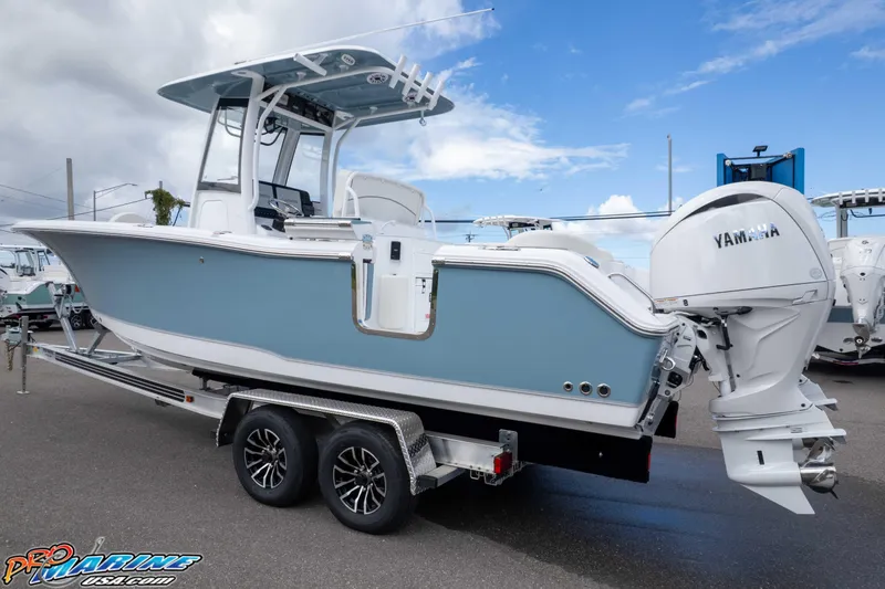 Slide: The Image of 2026 Sea Hunt Ultra 265 SE boat on trailer with Yamaha engine, side view. - 15