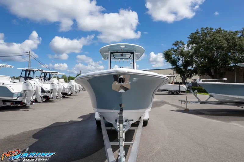Slide: The Image of 2026 Sea Hunt Ultra 265 SE boat on trailer under blue sky. - 2