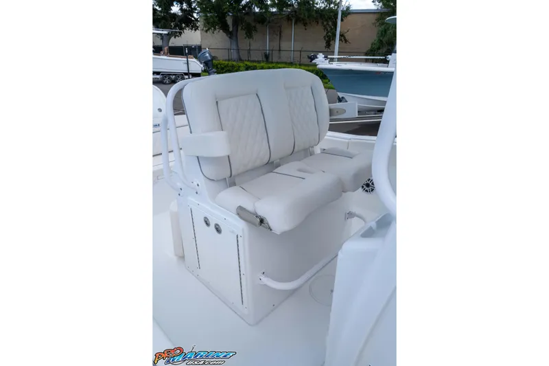 Slide: The Image of 2026 Sea Hunt Ultra 265 SE boat seating with white cushioned design. - 20