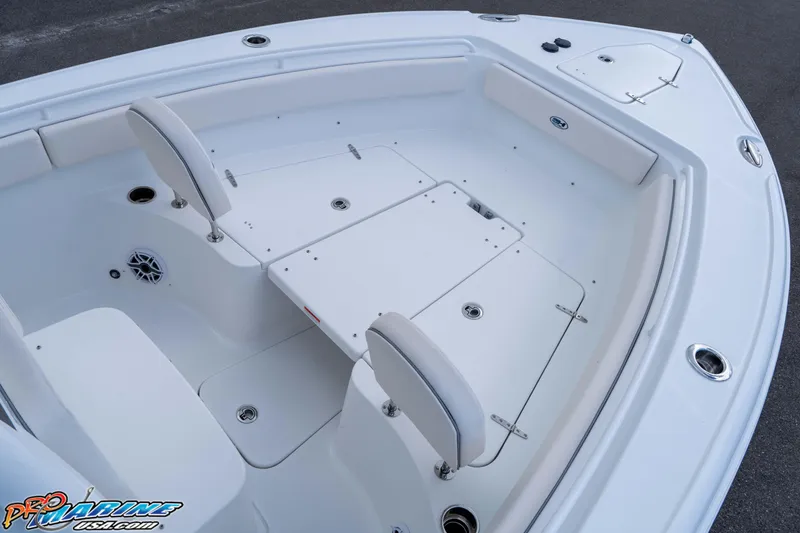 Slide: The Image of 2026 Sea Hunt Ultra 265 SE boat interior with seating and storage compartments. - 22