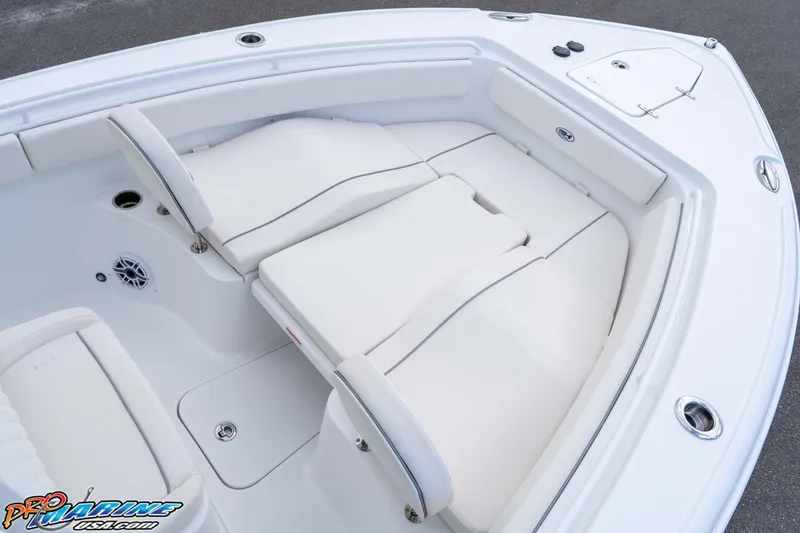 Slide: The Image of 2026 Sea Hunt Ultra 265 SE boat interior with white cushioned seating. - 26