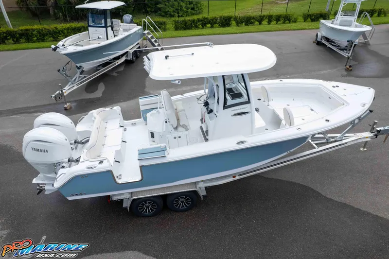 Slide: The Image of 2026 Sea Hunt Ultra 265 SE boat on trailer, featuring dual Yamaha engines. - 29