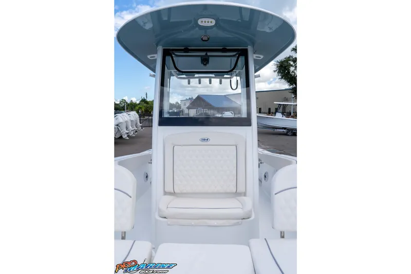Slide: The Image of 2026 Sea Hunt Ultra 265 SE boat interior with cushioned seating and modern design. - 30