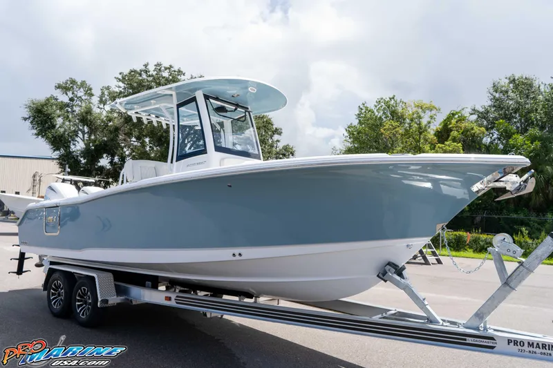 Slide: The Image of 2026 Sea Hunt Ultra 265 SE boat on trailer, parked outdoors. - 37