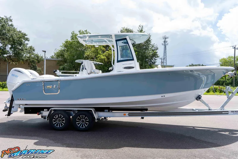Slide: The Image of 2026 Sea Hunt Ultra 265 SE boat on trailer, parked outdoors. - 47