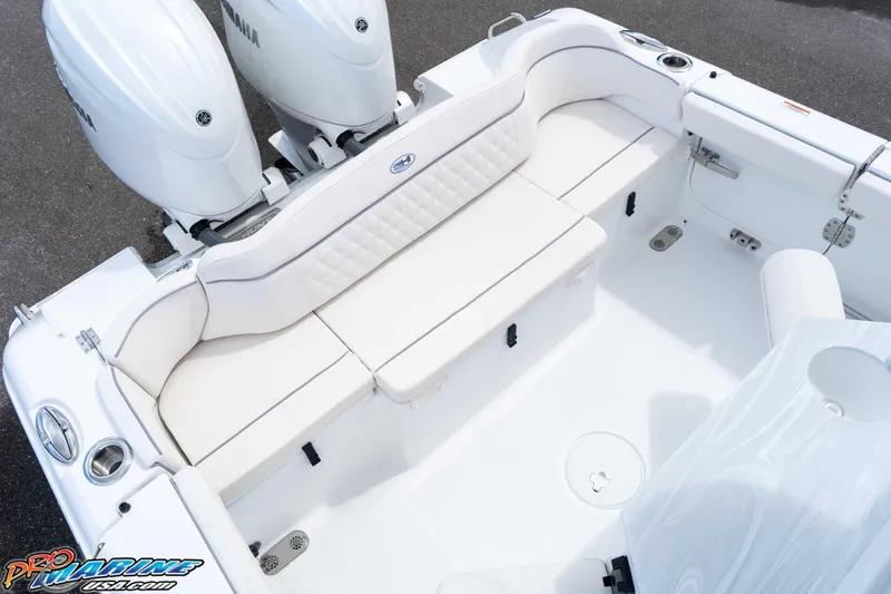 Slide: The Image of 2026 Sea Hunt Ultra 265 SE boat interior with Yamaha engines, featuring white seating and deck. - 5