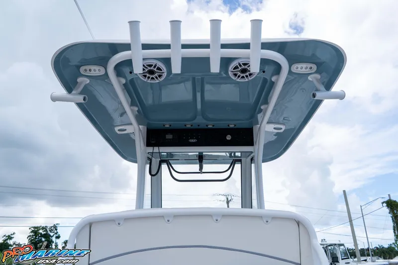 Slide: The Image of 2026 Sea Hunt Ultra 265 SE boat T-top with rod holders and speakers. - 9