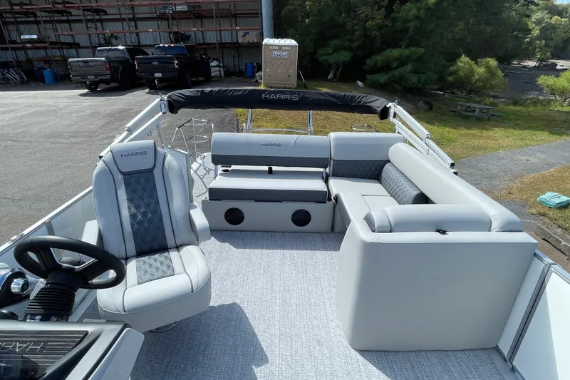 Slide: The Image of 2026 Harris FloteBote Cruiser 210 pontoon boat with luxurious seating and modern design. - 10