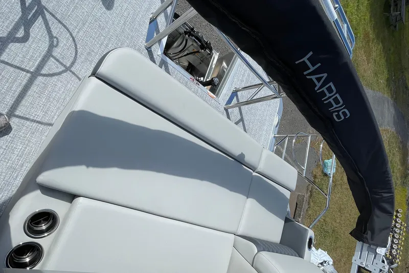 Slide: The Image of 2026 Harris FloteBote Cruiser 210 with sleek seating and canopy, showcasing luxury and comfort. - 11