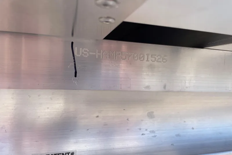 Slide: The Image of Harris FloteBote Cruiser 210, 2026 model, showing serial number on metallic surface. - 12