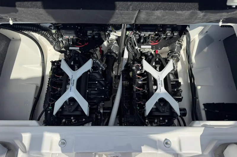 Slide: The Image of 2026 Yamaha Boats AR250 engine compartment with twin engines and wiring. - 12
