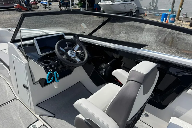 Slide: The Image of 2026 Yamaha Boats AR250 cockpit with modern steering and dashboard controls. - 15