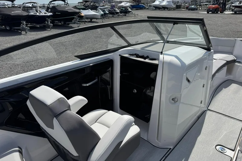 Slide: The Image of 2026 Yamaha Boats AR250 interior with sleek seating and modern dashboard design. - 16