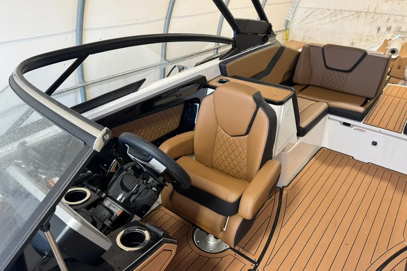 Slide: The Image of 2026 Yamaha Boats 252SD interior with tan leather seats and modern dashboard design. - 9