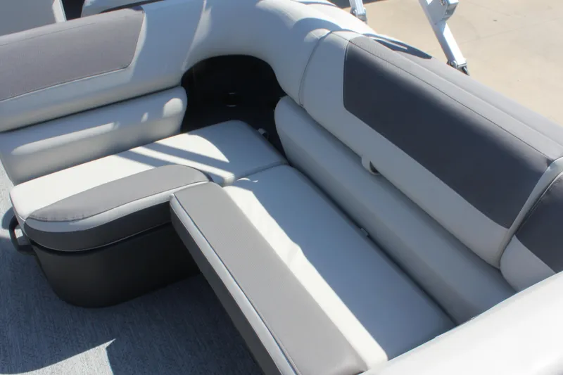 Slide: The Image of 2026 Sun Tracker Fishin' Barge 20 DLX, comfortable seating area in gray upholstery. - 13