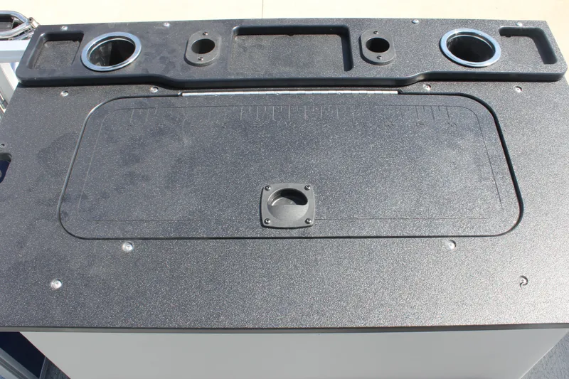 Slide: The Image of 2026 Sun Tracker Fishin' Barge 20 DLX fishing station with cup holders and storage compartments. - 20