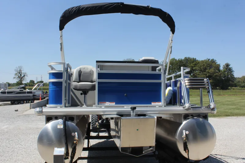Slide: The Image of 2026 Sun Tracker Fishin' Barge 20 DLX pontoon boat, rear view, outdoors. - 4