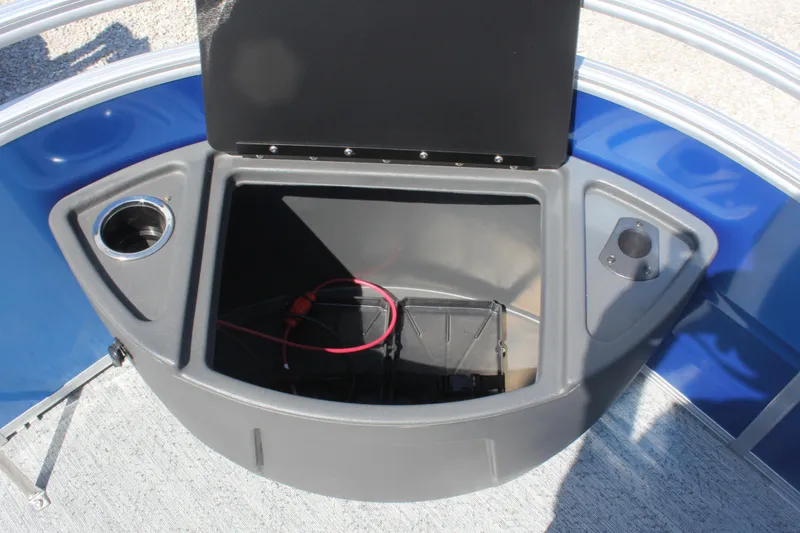 Slide: The Image of 2026 Sun Tracker Fishin' Barge 20 DLX storage compartment with cup holder and wiring. - 7
