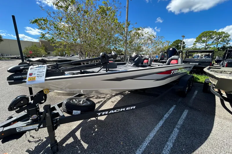 The Image of 2025 Tracker Savage 215 boat on trailer, displayed outdoors under clear sky. - 0