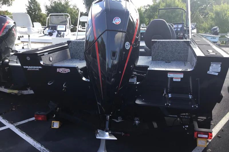 Slide: The Image of 2026 Tracker Targa V-19 Combo boat with powerful outboard motor, parked outdoors. - 11