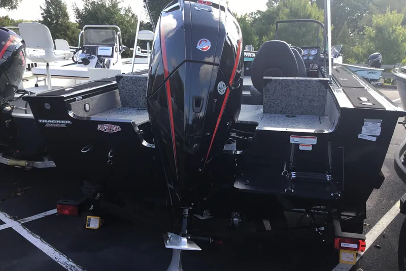 Slide: The Image of 2026 Tracker Targa V-19 Combo boat interior with swivel seat and dual windshields. - 12