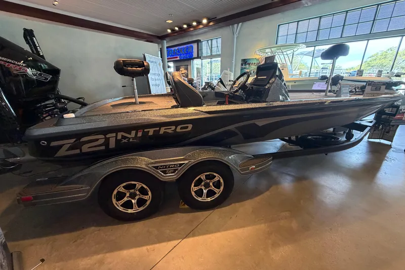 The Image of 2024 Nitro Z21 XL boat displayed indoors on a trailer. - 0