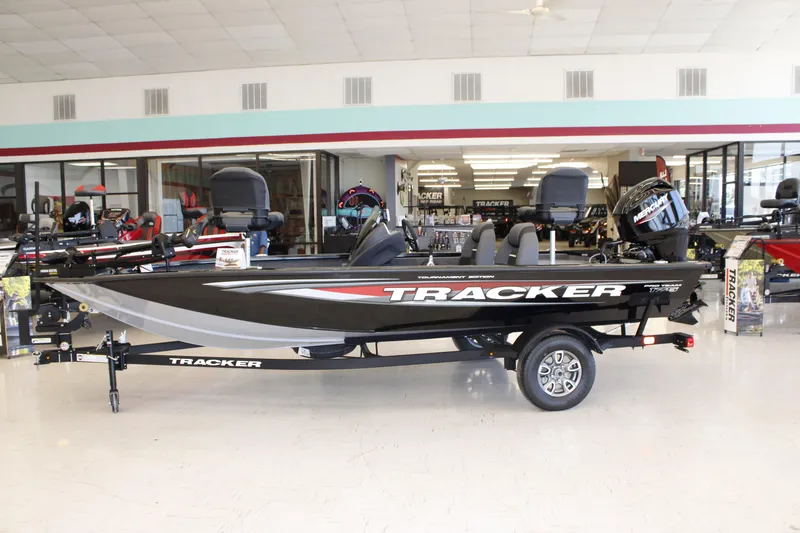 Slide: The Image of 2026 Tracker Pro Team 175 boat displayed in a showroom. - 3