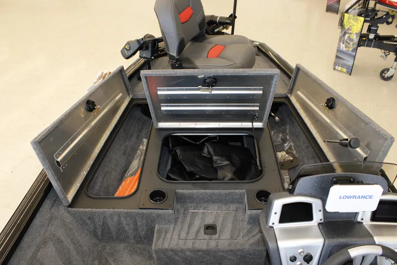 Slide: The Image of 2026 Tracker Pro Team 175 boat interior with storage compartments and Lowrance electronics. - 10