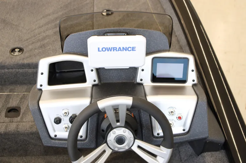 Slide: The Image of 2026 Tracker Pro Team 175 boat dashboard with Lowrance electronics and steering wheel. - 8