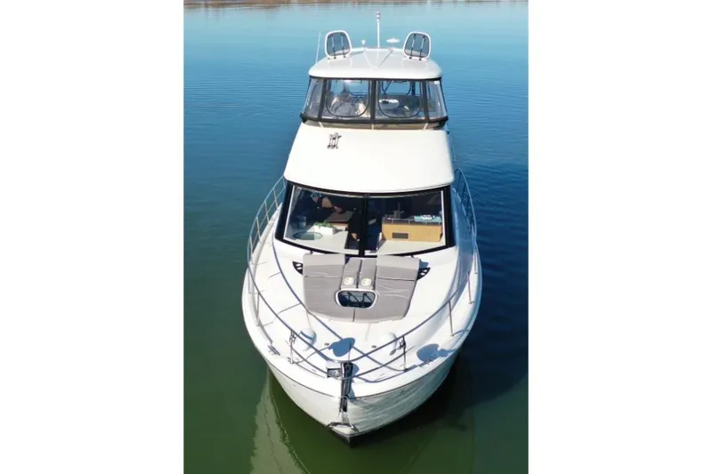 Slide: The Image of 2016 Meridian 441 yacht on calm water, aerial view. - 13