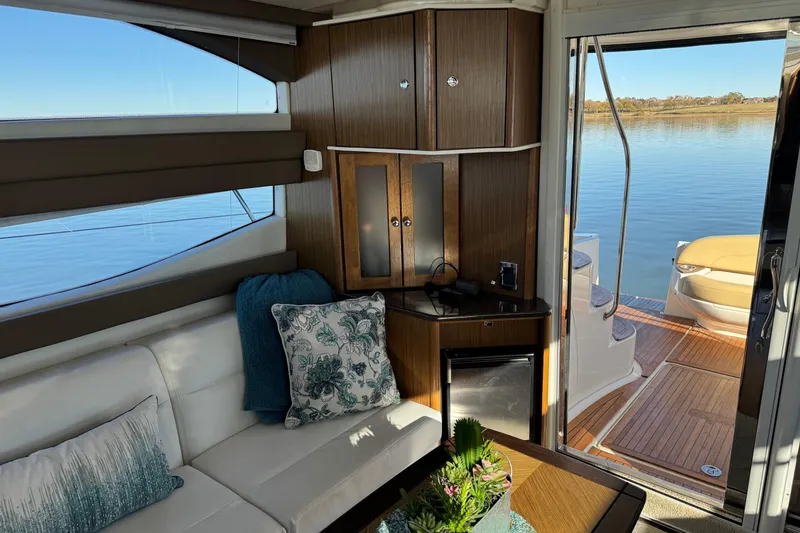 Slide: The Image of Interior of 2016 Meridian 441 yacht with elegant seating and scenic water view. - 30