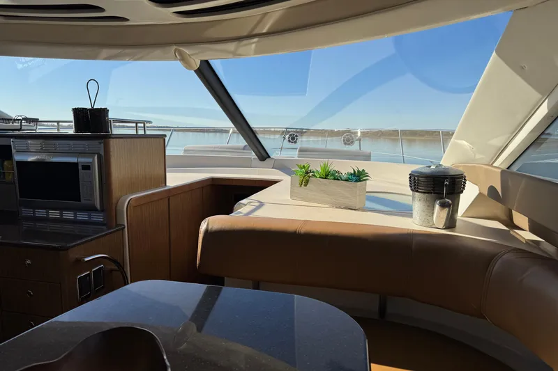 Slide: The Image of Interior of 2016 Meridian 441 yacht with modern kitchen and scenic ocean view. - 37