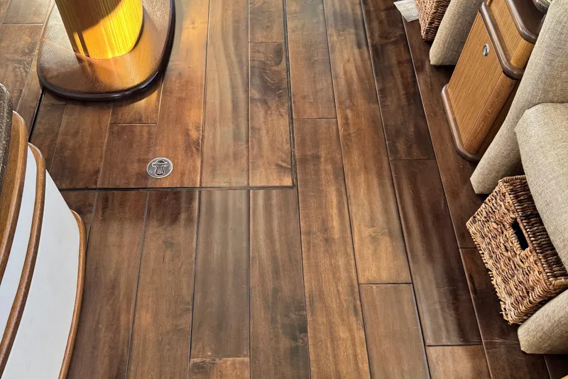 Slide: The Image of Luxurious wooden flooring inside a 2016 Meridian 441 yacht, featuring elegant wicker baskets. - 39