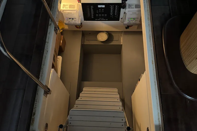 Slide: The Image of Engine room access of 2016 Meridian 441 yacht with control panels and equipment. - 40