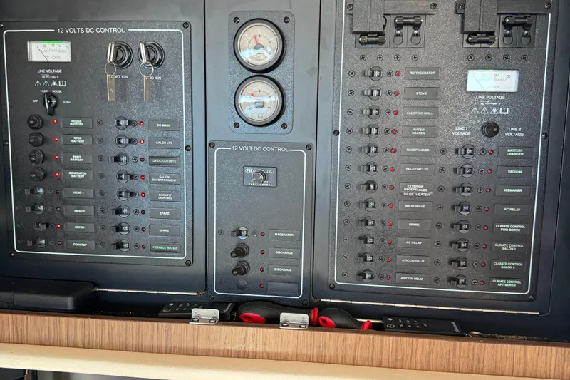 Slide: The Image of Electrical control panel of a 2016 Meridian 441 yacht, featuring various switches and gauges. - 43