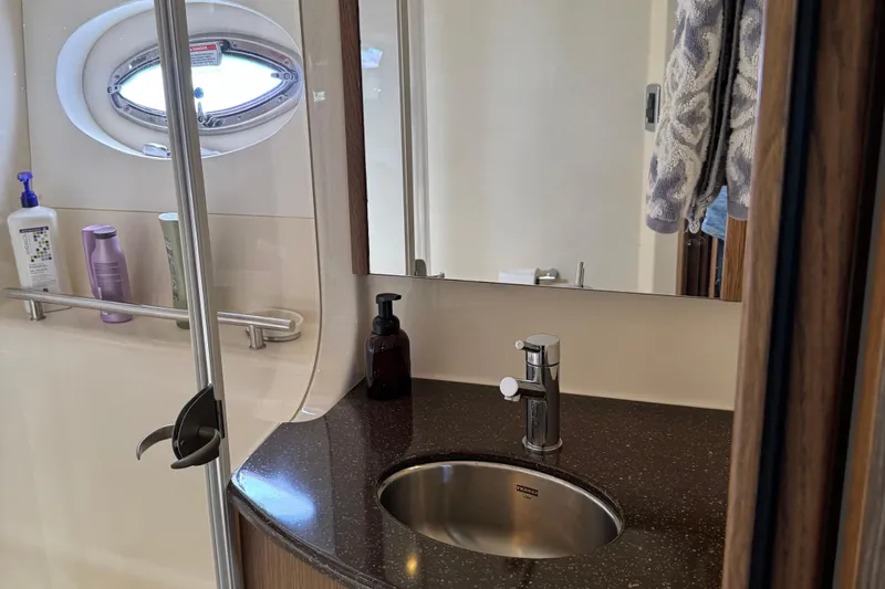 Slide: The Image of Bathroom interior of 2016 Meridian 441 yacht with sink and toiletries. - 50