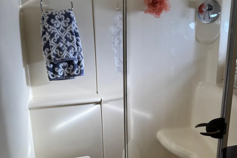 Slide: The Image of Shower area in 2016 Meridian 441 with patterned towel and glass door. - 51