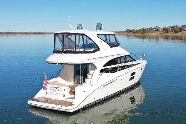 Slide: The Image of 2016 Meridian 441 yacht on calm water with clear blue sky. - 6