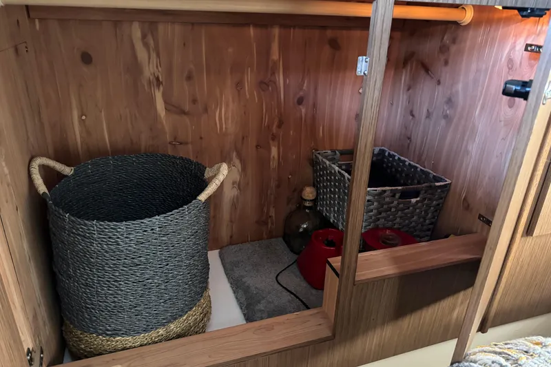 Slide: The Image of Storage area in a 2016 Meridian 441 with baskets and wooden interior. - 62