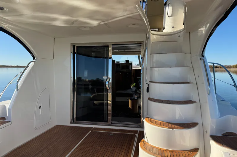 Slide: The Image of Luxurious 2016 Meridian 441 yacht interior with elegant staircase and sliding glass door. - 67