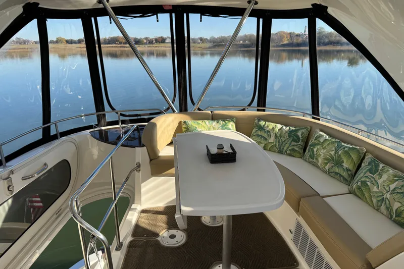Slide: The Image of Luxurious 2016 Meridian 441 yacht interior with elegant seating and scenic water view. - 70